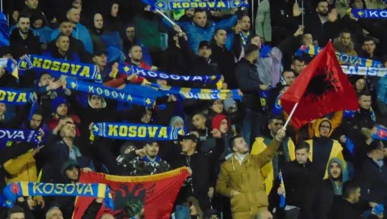 Kosovo football fans wave flags